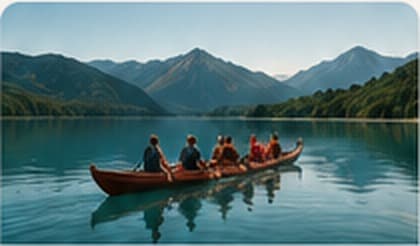 A waka crew paddling across a still lake beneath forested mountains